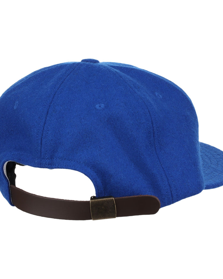 The EFF Montreal Royals 1954 Vintage Ballcap is a blue cap shown from the back, inspired by the original, and features a dark brown adjustable strap with a brass buckle.