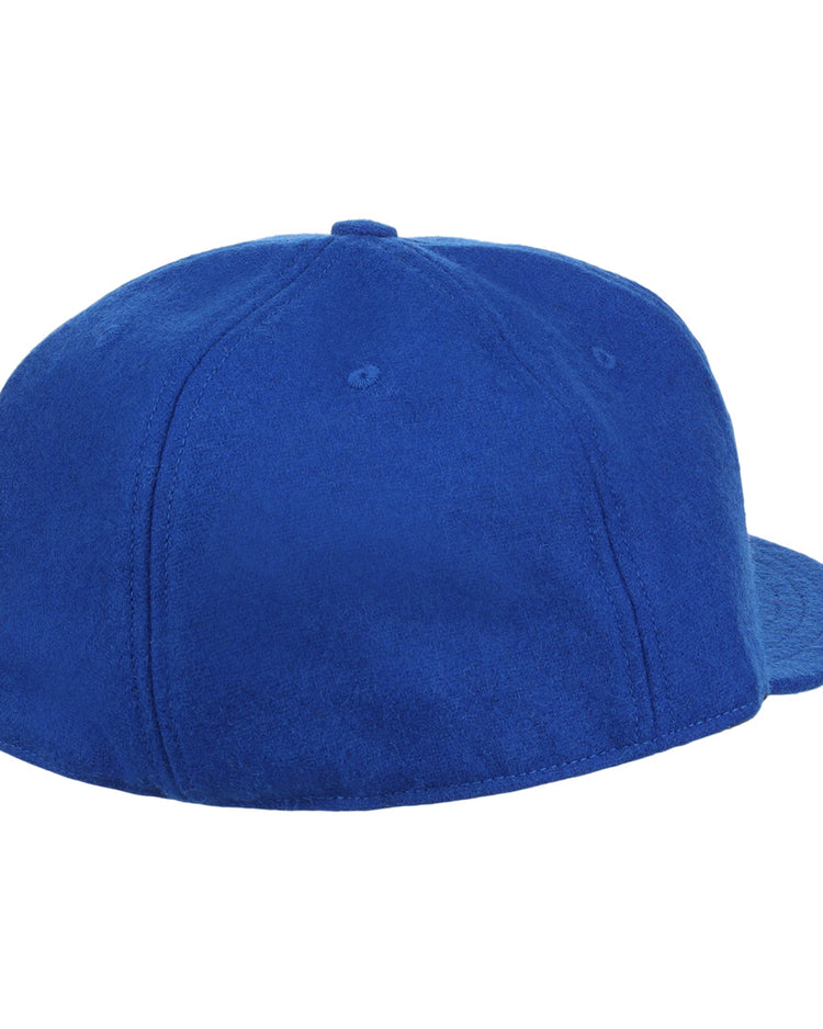 The EFF Montreal Royals 1954 Vintage Ballcap, crafted in genuine wool, is a plain royal blue cap shown from the back—with no logos or adjustable strap—evoking the classic style once worn by Roberto Clemente.