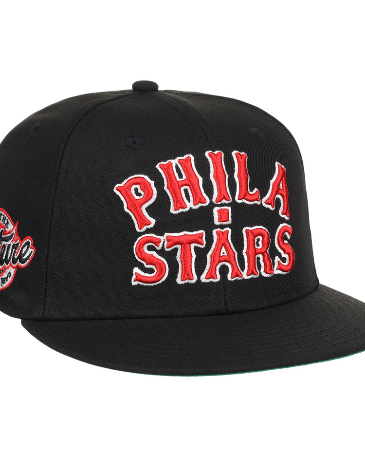 The EFF Cultural Excellence x Philadelphia Stars Fitted Ballcap features PHILA STARS in bold red and white, a Culture patch on the side, and classic streetwear style inspired by Negro League Baseball.