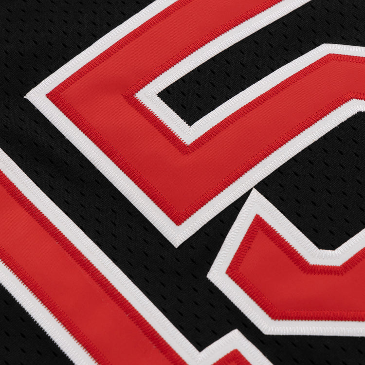 Close-up of the EFF Cultural Excellence x Philadelphia Stars Button Down Jersey, showcasing a black mesh design with red and white-outlined numbers and detailed stitching—honoring Negro League Baseball vintage style in modern streetwear.