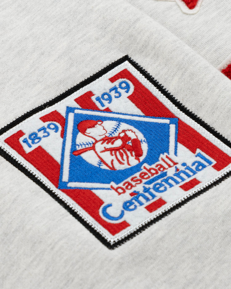 The EFF Cultural Excellence x Philadelphia Stars French Terry Hooded Sweatshirt features a patch inspired by Negro League Baseball, with 1839 1939 and Centennial around a red player silhouette in a blue diamond on red and white stripes—ideal for streetwear or collectors.