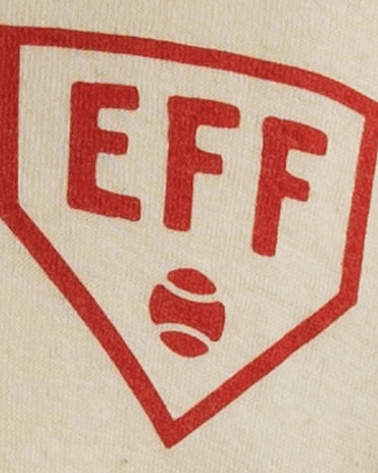 The Fungo Shirt - Red Sleeves by EFF features a red-outlined home plate with EFF at the top and a small baseball graphic, set against a light flannel baseball uniform background.