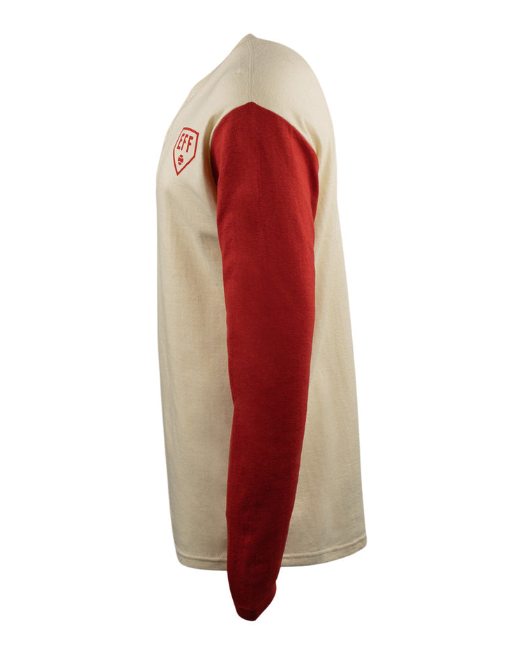 Side view of the EFF Fungo Shirt - Red Sleeves showing a cream body, red sleeves, and a small red and white shield logo on the upper left chest against a plain white background.