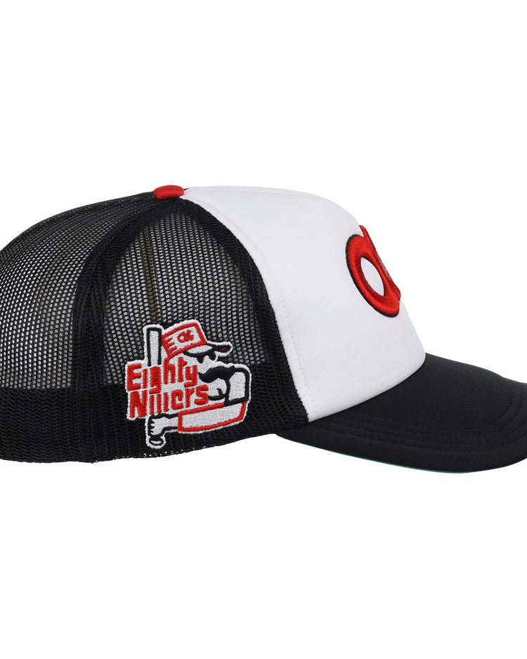 The EFF Oklahoma City 89ers Vintage Foam Trucker is a black and white mesh cap with a curved brim, bold red O on the front, embroidered Eighty Niners patch on the side, part of the MiLB Vintage collection.