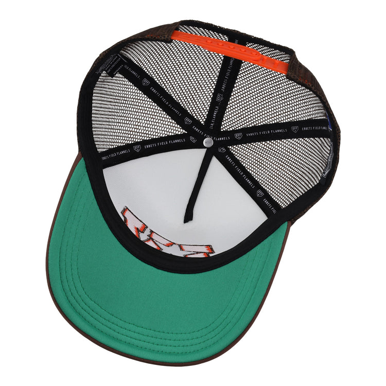 A close-up of the Las Vegas Stars EFF MiLB Vintage Foam Trucker by EFF, showing a green brim, orange accent, black mesh back, and snapback with black interior taping featuring white logos and “Ghosts Follow Flannel” text.
