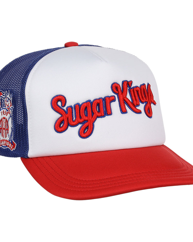 The EFF Havana Sugar Kings MiLB Vintage Foam Trucker cap features red, white, and blue colors, “Sugar Kings” embroidered in red on the front, and a patch honoring Havana baseball history with a crown, baseball, and 1954 on the side.