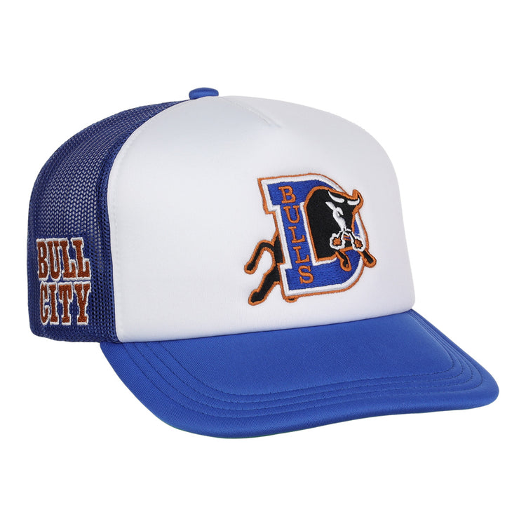 The EFF Durham Bulls EFF MiLB Vintage Foam Trucker hat features a blue and white design, mesh back, the Durham Bulls logo on front, and “BULL CITY” in orange on the side—a must-have for vintage Minor League fans.