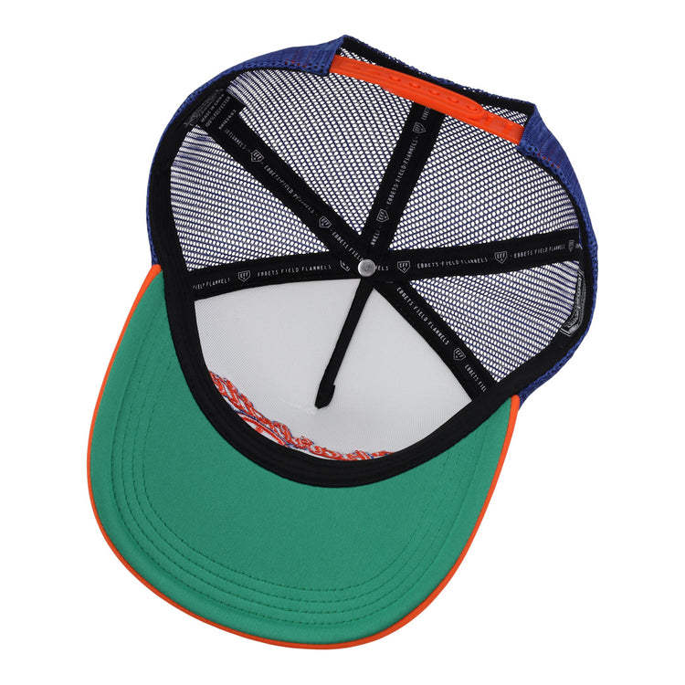 The image shows the inside of an EFF Charlotte Orioles EFF MiLB Vintage Foam Trucker hat, with a green brim, orange trim, and blue top. The interior features black mesh lining and seam tape with white text and symbols.