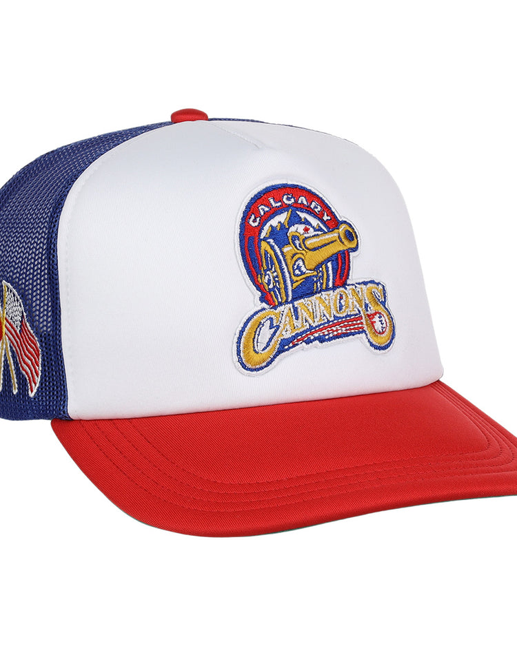The Calgary Cannons EFF MiLB Vintage Foam Trucker by EFF is a white, red, and blue hat with a yellow cannon logo on the front and small embroidered flags on the mesh side panel.