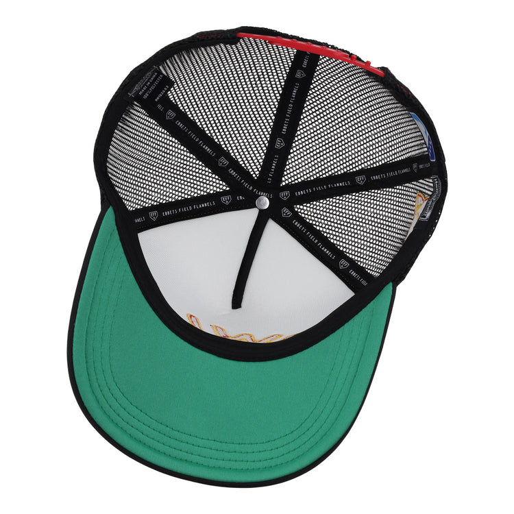 A top-down view of the EFF Topeka Owls EFF MiLB Vintage Foam Trucker shows its black foam crown mesh snapback, green brim, black sweatband, exposed stitching, inner labels, and a white center button.