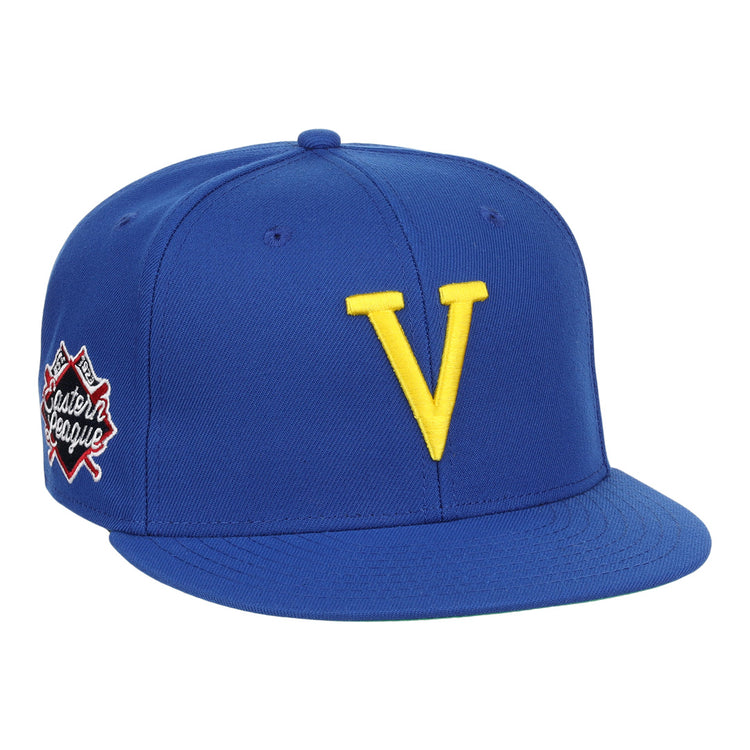 The Vermont Mariners EFF MiLB Vintage Snapback by Ebbets Field Flannels features a blue adjustable cap with a bold yellow V front and an Eastern League patch—perfect for Vermont Mariners fans and vintage collectors.