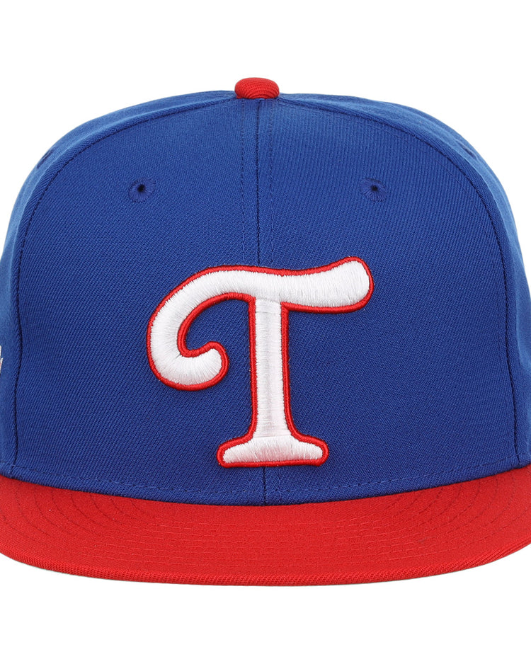 The Tulsa Drillers EFF MiLB Vintage Snapback by Ebbets Field Flannels features a blue crown, red brim, and large white T outlined in red, inspired by the classic Tulsa Drillers cap from the Texas Leagues Vintage Minor League collection.