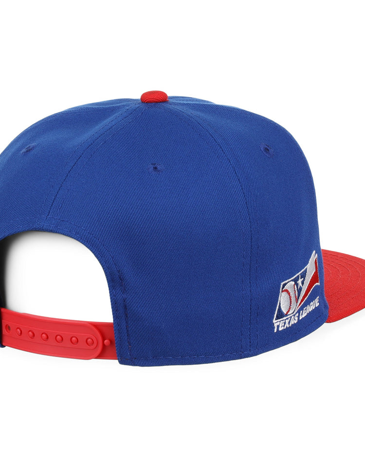 The Ebbets Field Flannels Tulsa Drillers EFF MiLB Vintage Snapback is a blue cap with a red adjustable strap and brim, Texas League logo patch on the side, shown from the back and side. Part of the Vintage Minor League collection.