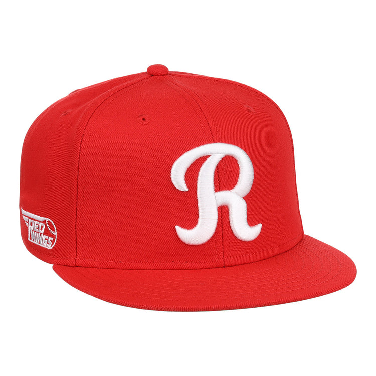 The Ebbets Field Flannels Rochester Red Wings EFF MiLB Vintage Snapback is a bright red cap with a flat brim, featuring a white “R” on the front and a side patch, honoring Cal Ripken Jr. as part of the Vintage Minor League collection.