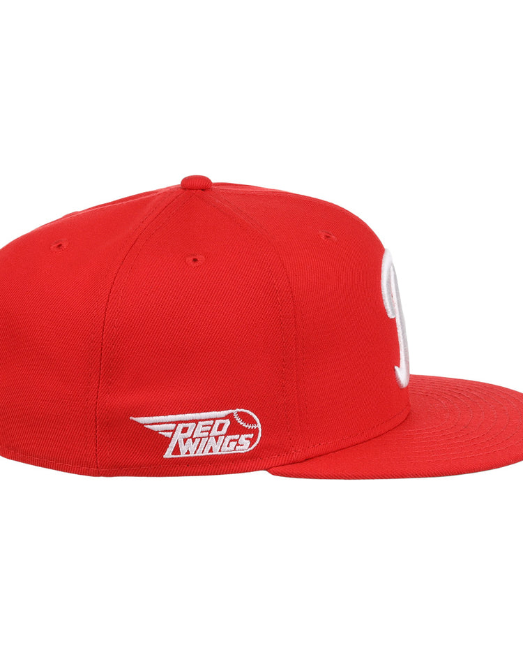 The Ebbets Field Flannels Rochester Red Wings EFF MiLB Vintage Snapback is a red flat-brim cap with a white team logo and wing graphic on the side, shown against a plain white background.