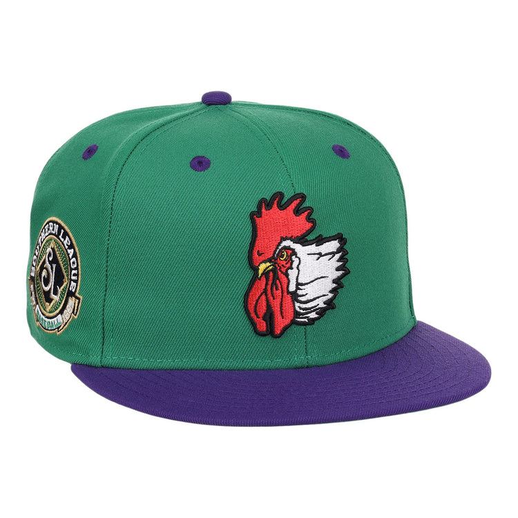 The Port City Roosters EFF MiLB Vintage Snapback by Ebbets Field Flannels is a green cap with a purple brim, featuring an embroidered rooster head and a Southern League patch, inspired by vintage minor league style.