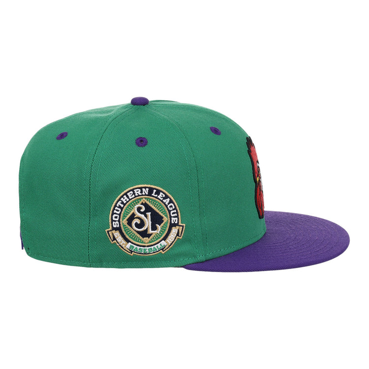 The Port City Roosters EFF MiLB Vintage Snapback by Ebbets Field Flannels sports a green crown, purple brim, and “Southern League Baseball” patch. Purple details complete its classic Minor League style—ideal for Roosters fans.