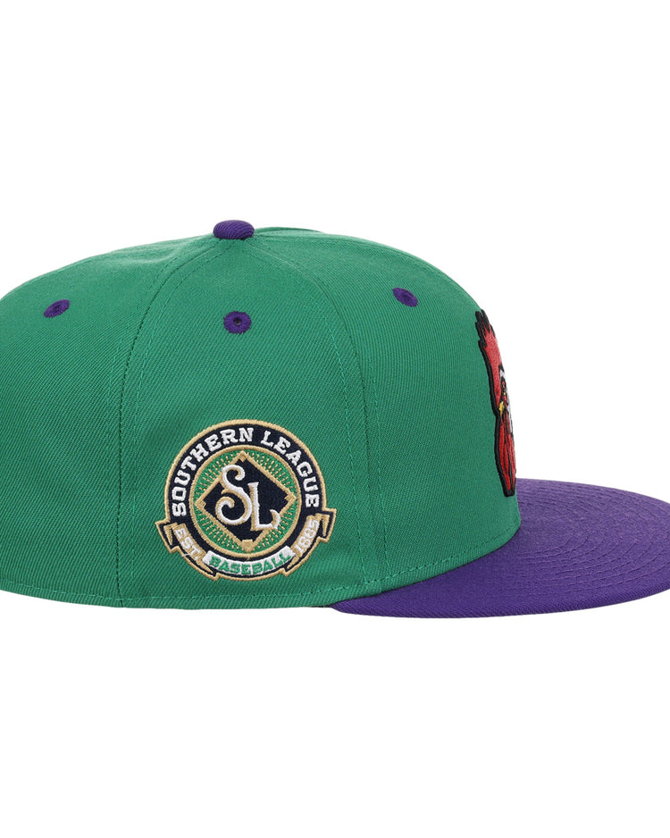 The Port City Roosters EFF MiLB Vintage Snapback by Ebbets Field Flannels sports a green crown, purple brim, and “Southern League Baseball” patch. Purple details complete its classic Minor League style—ideal for Roosters fans.