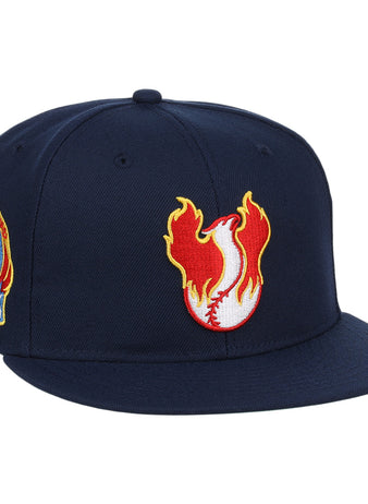 The Phoenix Firebirds EFF MiLB Vintage Snapback by Ebbets Field Flannels is a navy snapback with a flaming baseball logo up front and a colorful embroidered Phoenix Firebirds patch on the side, inspired by vintage Pacific Coast League style.