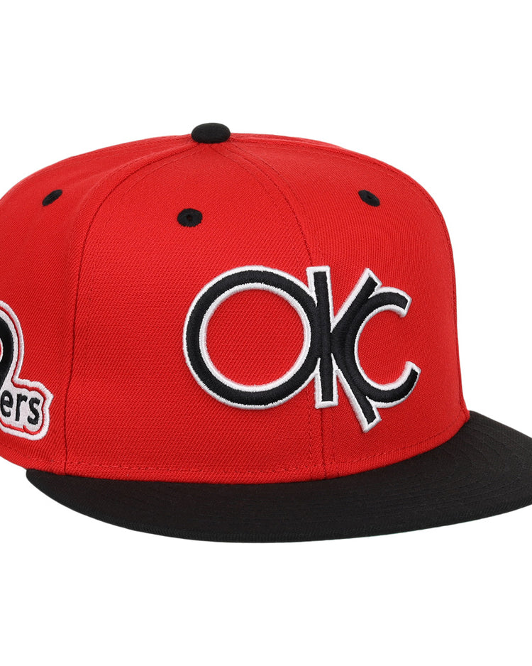 The Oklahoma City 89ers EFF MiLB Vintage Snapback by Ebbets Field Flannels is a red and black adjustable hat with a large OKC logo front and an 89ers side patch, from our Vintage Minor League collection.
