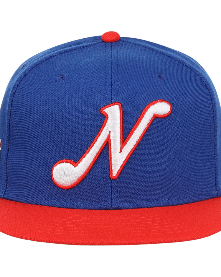 The Ebbets Field Flannels Nashville Sounds EFF MiLB Vintage Snapback features a blue crown, red brim, and a bold 3D white ’N’ logo with red outline on the front.