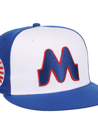 The Memphis Chicks EFF MiLB Vintage Snapback by Ebbets Field Flannels is a blue and white adjustable cap with a bold red-outlined M on the front and circular logo on the side, part of the Vintage Minor League collection.