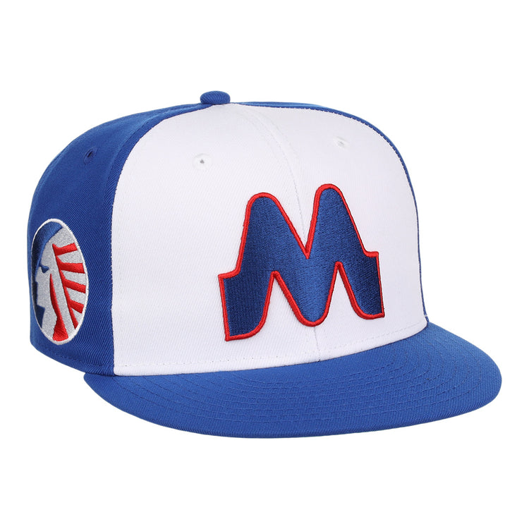 The Memphis Chicks EFF MiLB Vintage Snapback by Ebbets Field Flannels is a blue and white adjustable cap with a bold red-outlined M on the front and circular logo on the side, part of the Vintage Minor League collection.