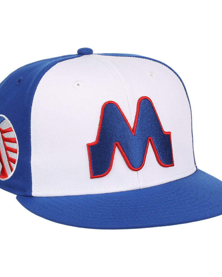 The Memphis Chicks EFF MiLB Vintage Snapback by Ebbets Field Flannels is a blue and white adjustable cap with a bold red-outlined M on the front and circular logo on the side, part of the Vintage Minor League collection.