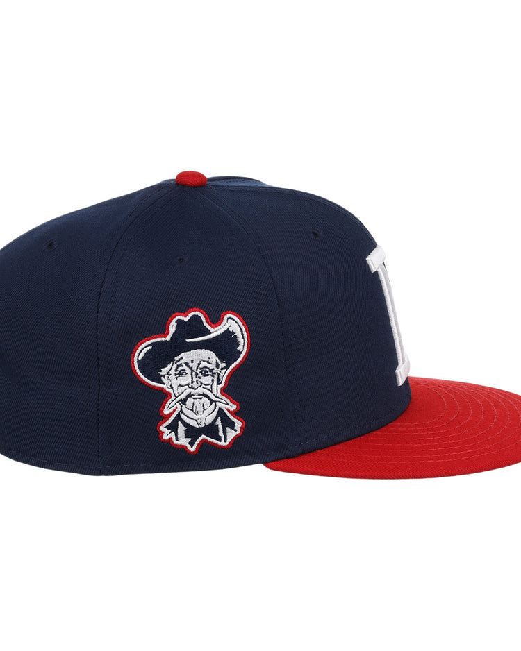 The Louisville Colonels EFF MiLB Vintage Snapback by Ebbets Field Flannels features a navy crown, red brim, white “L” front logo, cartoon cowboy face on the side, and an adjustable snapback from the Vintage Minor League collection.