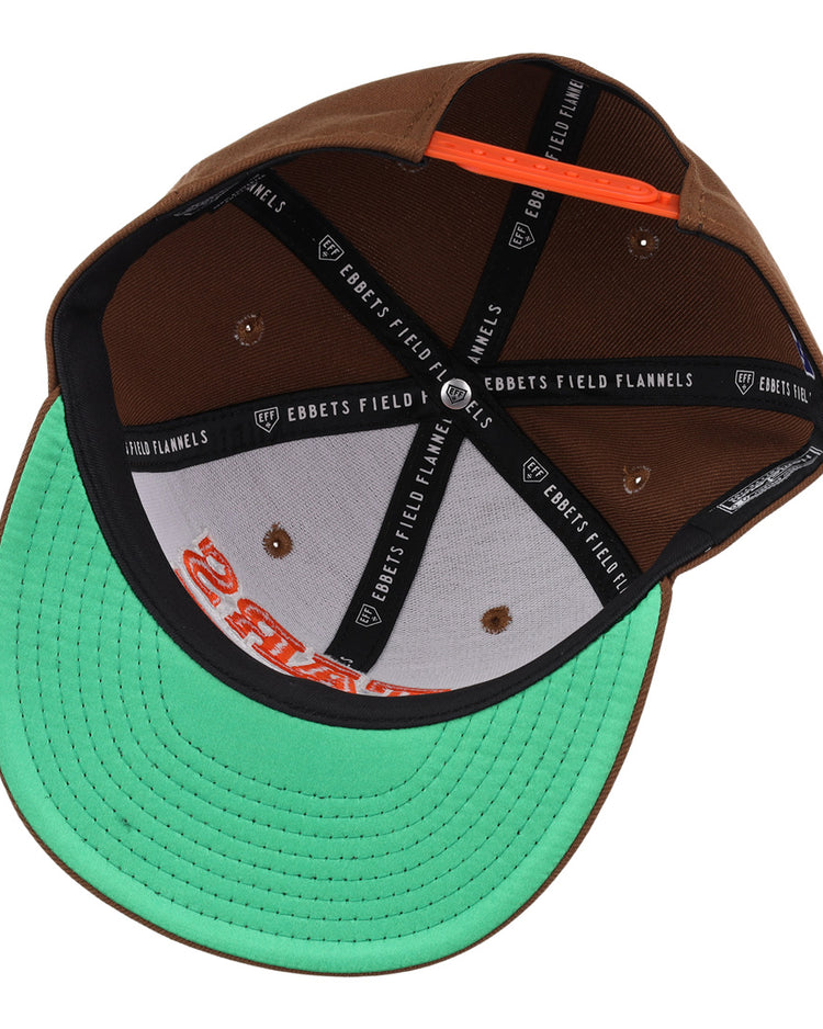 The Las Vegas Stars EFF MiLB Vintage Snapback by Ebbets Field Flannels features a brown exterior, black branded taping inside, a green underbrim, and an orange snapback strap—ideal for fans of vintage minor league style.