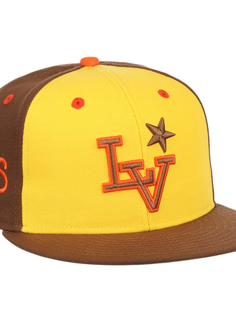 The Ebbets Field Flannels Las Vegas Stars EFF MiLB Vintage Snapback in yellow features a brown brim, orange LV logo, brown star on the front, and an embroidered “Las Vegas Stars” Minor League Baseball logo on the side.