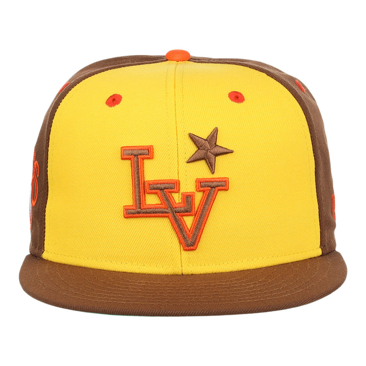 The Ebbets Field Flannels Las Vegas Stars EFF MiLB Vintage Snapback in yellow features brown brim and side panels, an orange LV logo, a brown star on the front, and an orange top button, inspired by the Vintage Minor League team.