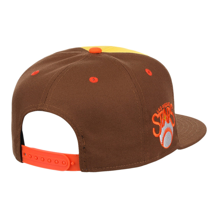 The Ebbets Field Flannels Las Vegas Stars EFF MiLB Vintage Snapback features a yellow cap with brown panels, orange strap and eyelets, embroidered ASTROS logo, white baseball with orange star on the side, and a vintage Minor League style.