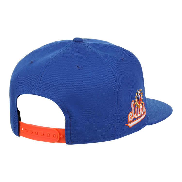 The Ebbets Field Flannels Jacksonville Suns EFF MiLB Vintage Snapback features a blue body, orange adjustable strap, and embroidered side logo, shown from the back and side. Part of the Vintage Minor League collection.