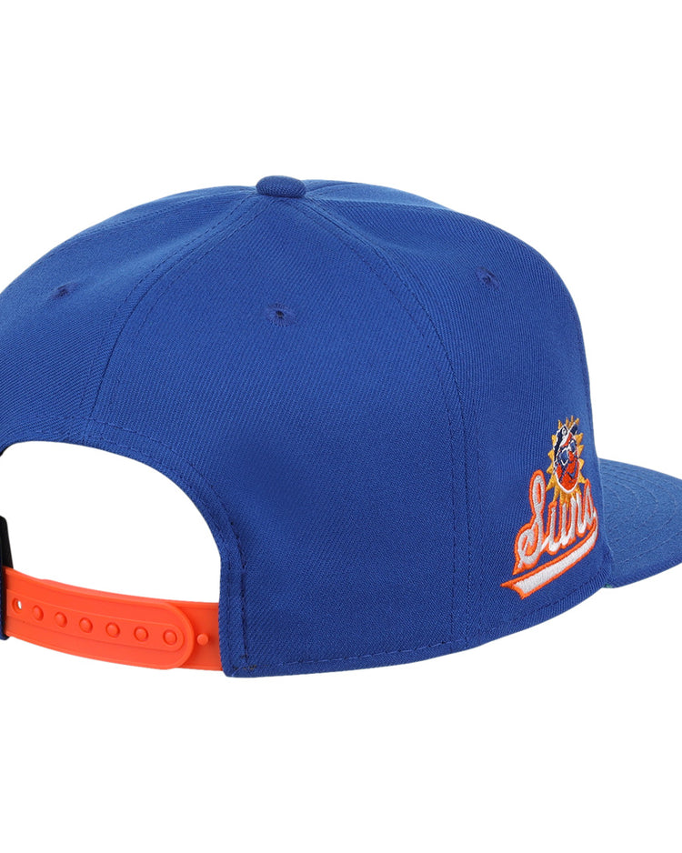 The Ebbets Field Flannels Jacksonville Suns EFF MiLB Vintage Snapback features a blue body, orange adjustable strap, and embroidered side logo, shown from the back and side. Part of the Vintage Minor League collection.