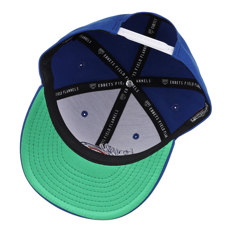 The Iowa Cubs EFF MiLB Vintage Snapback by Ebbets Field Flannels features a blue crown, green brim seen from underneath, black inner band with EBBETS FIELD FLANNELS branding, and a white adjustable snapback strap at the back.