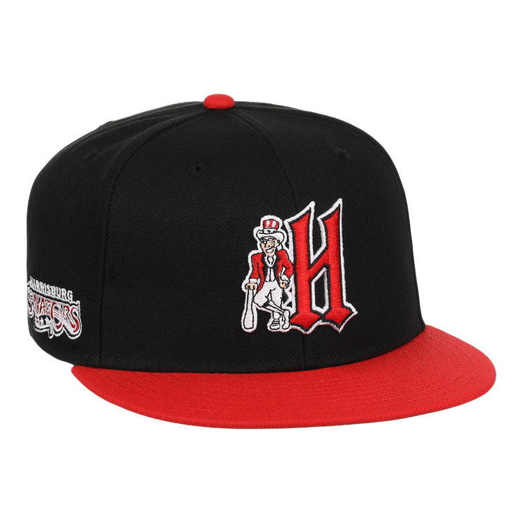 The Harrisburg Senators EFF MiLB Vintage Snapback by Ebbets Field Flannels features a black and red design, large red H with a cartoon character holding a bat, plus team logo on the side—perfect for vintage Minor League fans.