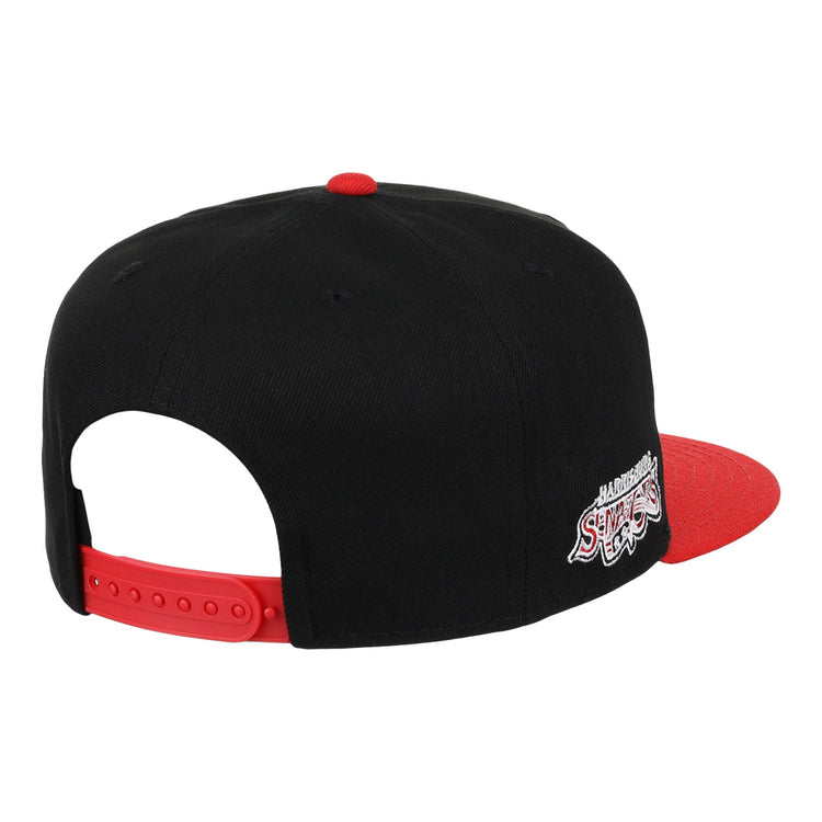 The Harrisburg Senators EFF MiLB Vintage Snapback by Ebbets Field Flannels is a black cap with a red brim and strap, featuring an embroidered Harlem Shake logo in white and red on the back, inspired by vintage Minor League style.