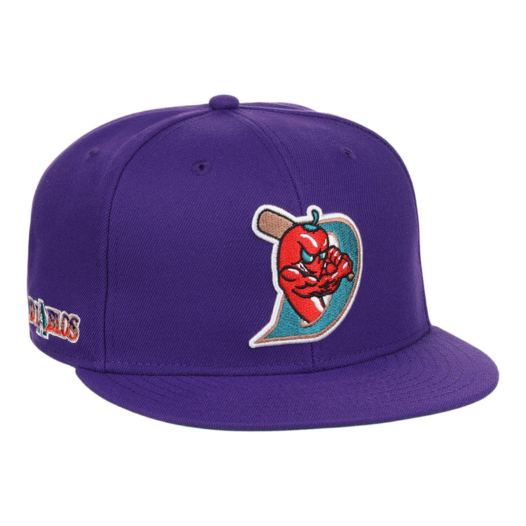 The El Paso Diablos EFF MiLB Vintage Snapback by Ebbets Field Flannels is a purple cap with an embroidered muscular red apple holding a bat and a stylized D, plus multicolored side text—part of the unique Vintage Minor League collection.