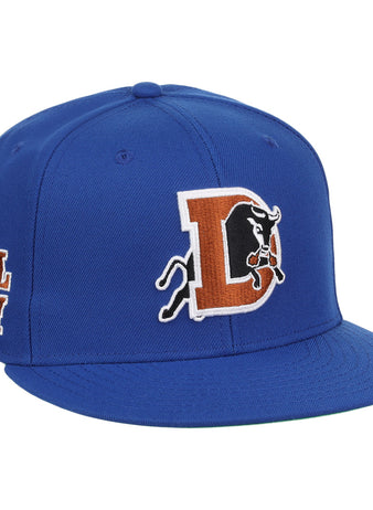 The Durham Bulls EFF MiLB Vintage Snapback by Ebbets Field Flannels features a large “D” with charging bull logo and BULL CITY embroidered on the side, capturing a vintage Minor League style inspired by the Durham Bulls.