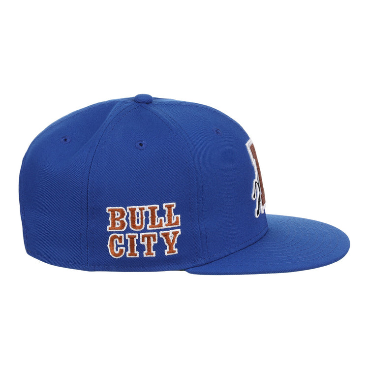 The Durham Bulls EFF MiLB Vintage Snapback by Ebbets Field Flannels is a blue adjustable cap with BULL CITY embroidered in white and orange, flat brim, ventilation holes, and classic Minor League style.