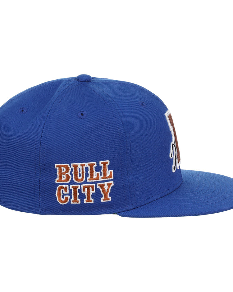 The Durham Bulls EFF MiLB Vintage Snapback by Ebbets Field Flannels is a blue adjustable cap with BULL CITY embroidered in white and orange, flat brim, ventilation holes, and classic Minor League style.
