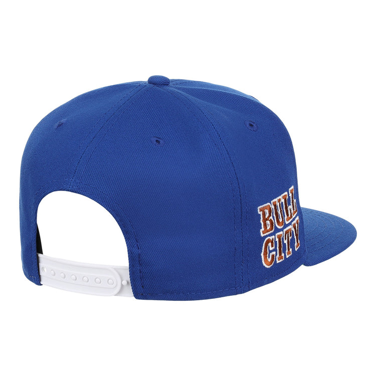 The Durham Bulls EFF MiLB Vintage Snapback by Ebbets Field Flannels is a blue adjustable cap with a white back strap and orange and white “BULL CITY” embroidery—ideal for Durham Bulls fans or vintage Minor League style lovers.