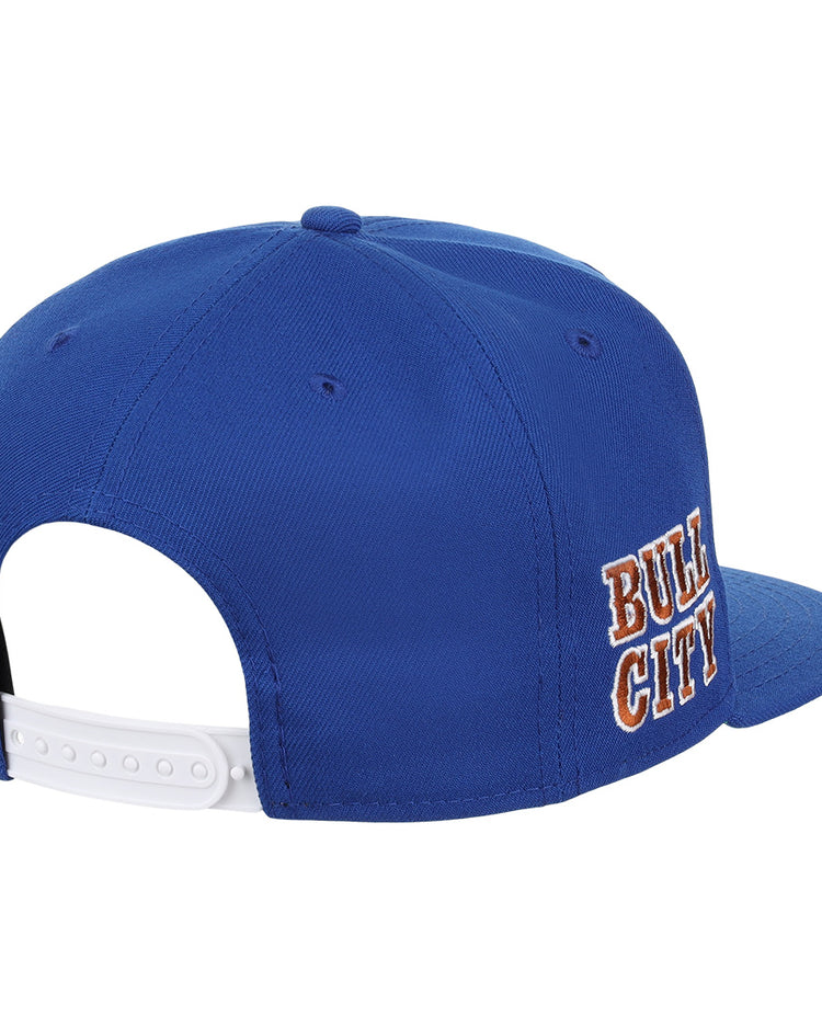 The Durham Bulls EFF MiLB Vintage Snapback by Ebbets Field Flannels is a blue adjustable cap with a white back strap and orange and white “BULL CITY” embroidery—ideal for Durham Bulls fans or vintage Minor League style lovers.