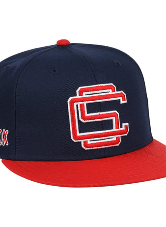 The Colorado Springs Sky Sox EFF MiLB Vintage Snapback by Ebbets Field Flannels features a navy and red design, an interlocking CS logo on the front, SOX embroidery on the side, and an adjustable snapback closure.