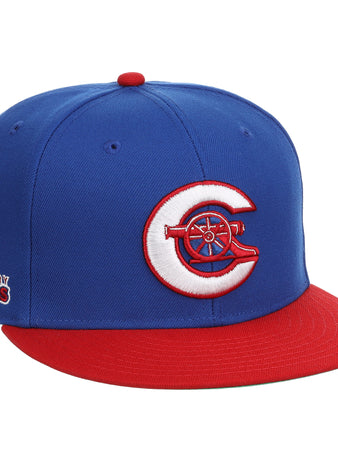 The Calgary Cannons EFF MiLB Vintage Snapback by Ebbets Field Flannels is a blue cap with a red brim, featuring a white and red C logo with a cannon on the front and an embroidered Legendary Cannons patch on the side.