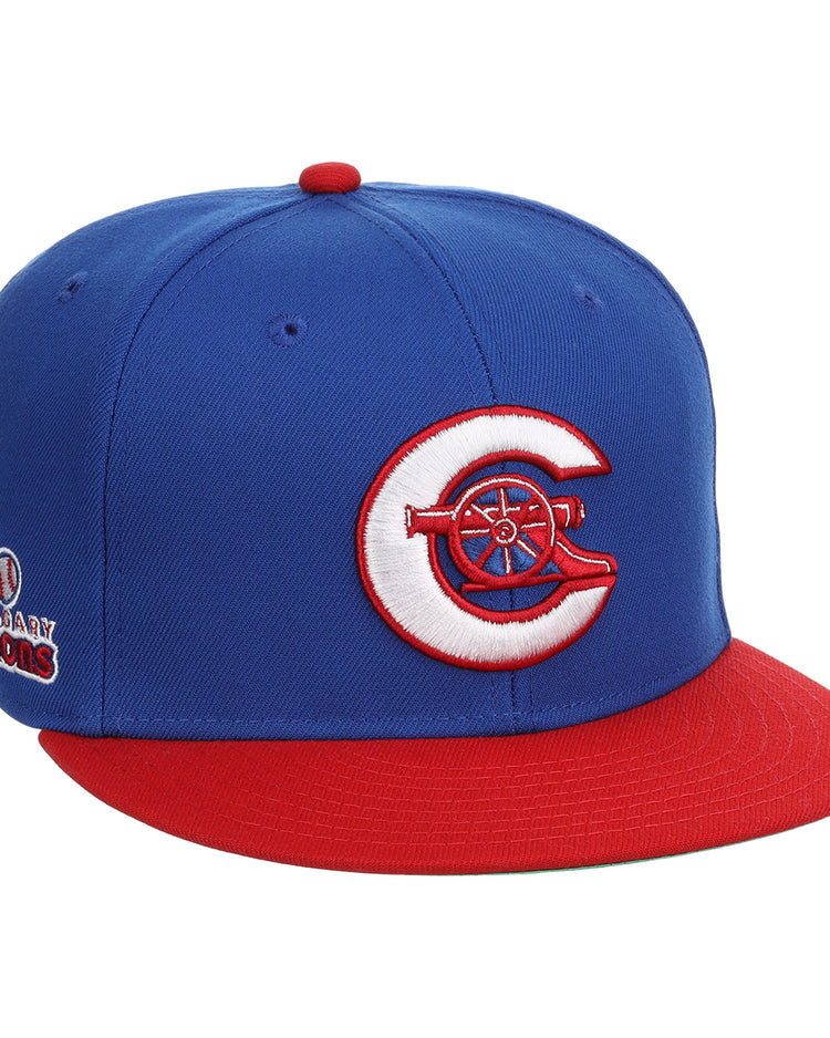 The Calgary Cannons EFF MiLB Vintage Snapback by Ebbets Field Flannels is a blue cap with a red brim, featuring a white and red C logo with a cannon on the front and an embroidered Legendary Cannons patch on the side.