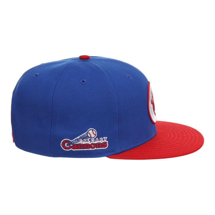 The Calgary Cannons EFF MiLB Vintage Snapback by Ebbets Field Flannels is a blue cap with a red brim, featuring the team logo, name embroidered on the side, and a baseball with bat graphic.
