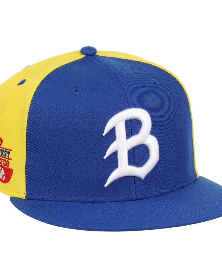 The Ebbets Field Flannels Burlington Bees EFF MiLB Vintage Snapback is a blue and yellow adjustable cap featuring a white B on the front and a Mid West League patch with baseball and bat on the side.