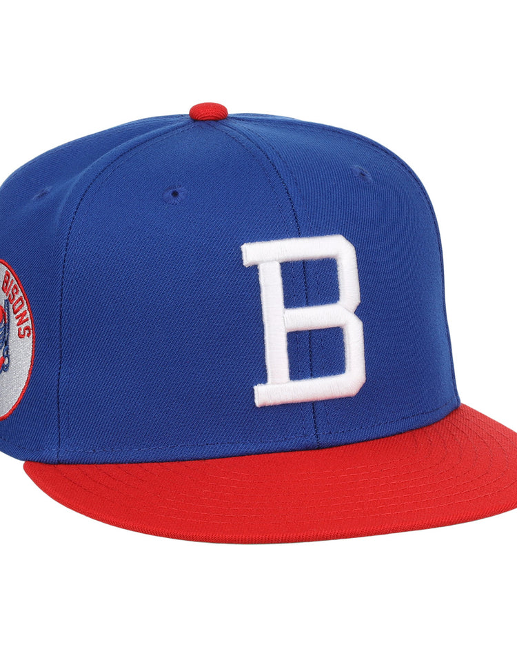 The Buffalo Bisons EFF MiLB Vintage Snapback by Ebbets Field Flannels features a blue crown, red brim, white “B” front logo, and bison side patch—an adjustable hat celebrating classic style from the Vintage Minor League collection.